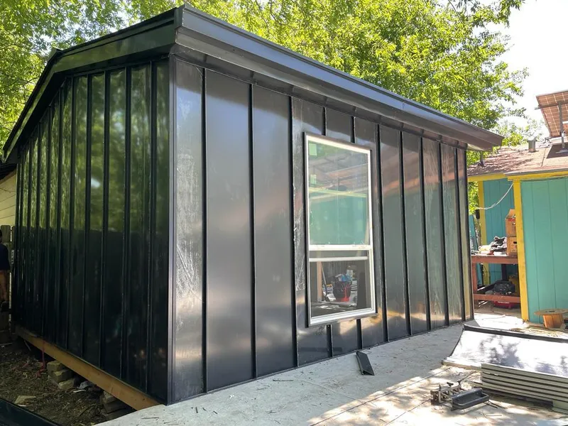 Black standing seam metal wall panels for Roof Inspection in Willis