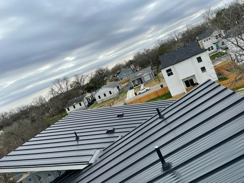 Standing seam metal roof panels with vents for Skylight Repair in Willis
